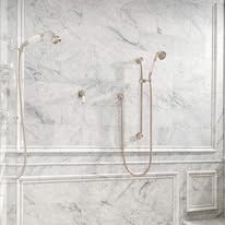Elegant marble shower wall with dual handheld fixtures
